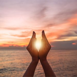 Hands around sun